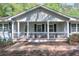 Inviting covered front porch with decorative columns and black metal railings at 1590 Arden Sw Dr, Marietta, GA 30008