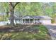 Charming house with a well-maintained front yard, new mulch, and a classic American feel at 1590 Arden Sw Dr, Marietta, GA 30008