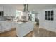 Modern kitchen with white cabinetry, stainless steel appliances, and a center island at 1590 Arden Sw Dr, Marietta, GA 30008