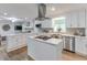 Stylish kitchen featuring white cabinets, stainless appliances, and a functional island at 1590 Arden Sw Dr, Marietta, GA 30008