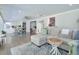 Spacious living room with a comfortable sofa, stylish rug, and an open view into the kitchen at 1590 Arden Sw Dr, Marietta, GA 30008