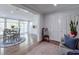 Open floor plan showcasing a dining area leading to a bright kitchen with white cabinetry at 1590 Arden Sw Dr, Marietta, GA 30008