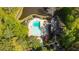 Aerial view of a sparkling pool and clubhouse surrounded by mature trees, highlighting the community's amenities at 2685 Hearthstone Cir, Marietta, GA 30062