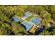 Aerial view of tennis courts with lush landscaping, showcasing the community's recreational facilities at 2685 Hearthstone Cir, Marietta, GA 30062