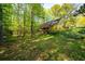 Expansive backyard with a wooden deck, perfect for outdoor entertaining and enjoying the natural surroundings at 2685 Hearthstone Cir, Marietta, GA 30062