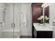 Modern bathroom with a glass shower, marble vanity, and elegant dark wood cabinets at 2685 Hearthstone Cir, Marietta, GA 30062