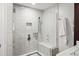Bathroom featuring a large glass walk-in shower with marble tiling and a built-in bench at 2685 Hearthstone Cir, Marietta, GA 30062