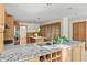Gourmet kitchen boasting an oversized granite countertop, custom cabinetry, and modern stainless steel appliances at 2685 Hearthstone Cir, Marietta, GA 30062