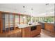 Open kitchen with a central island, wooden cabinetry, modern appliances, and seamless access to the outdoors at 2685 Hearthstone Cir, Marietta, GA 30062