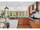 Bright kitchen featuring a large window, granite countertops, wooden cabinets, and stainless steel appliances at 2685 Hearthstone Cir, Marietta, GA 30062