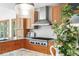 Well-appointed kitchen featuring custom cabinetry, a stainless steel range hood, and granite countertops at 2685 Hearthstone Cir, Marietta, GA 30062