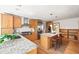 Spacious kitchen with granite countertops, a central island, stainless steel appliances, and hardwood floors at 2685 Hearthstone Cir, Marietta, GA 30062