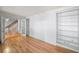 Comfortable living room featuring hardwood floors, a staircase, and custom shelving at 2685 Hearthstone Cir, Marietta, GA 30062