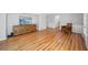 Spacious living room with hardwood floors and a wooden cabinet beneath a beach painting at 2685 Hearthstone Cir, Marietta, GA 30062