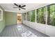 Serene screened-in porch with views of the wooded backyard and access to the adjacent indoor dining area at 2685 Hearthstone Cir, Marietta, GA 30062