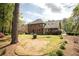 Expansive backyard featuring a manicured lawn and patio seating area perfect for relaxation and outdoor activities at 393 Westminister Sw Ln, Lilburn, GA 30047
