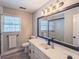 Modern bathroom featuring stylish vanity, sleek fixtures, and a walk-in shower at 393 Westminister Sw Ln, Lilburn, GA 30047