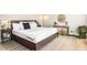 Cozy bedroom featuring a queen-size bed, stylish rug, and comfortable decor at 393 Westminister Sw Ln, Lilburn, GA 30047