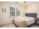 Comfortable bedroom with a large window that offers plenty of natural light at 393 Westminister Sw Ln, Lilburn, GA 30047
