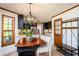 Eat-in dining area features a stylish light fixture and an access to the kitchen at 393 Westminister Sw Ln, Lilburn, GA 30047