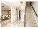 Inviting foyer with patterned tile flooring and staircase access to the upper level at 393 Westminister Sw Ln, Lilburn, GA 30047