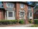 Close-up view of the home's front entrance with brick steps and a decorative wreath at 393 Westminister Sw Ln, Lilburn, GA 30047