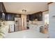 View of updated kitchen with stainless steel appliances and black and white cabinets at 393 Westminister Sw Ln, Lilburn, GA 30047