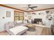 Cozy living room with a decorative fireplace, built-in shelving, and lots of natural light at 393 Westminister Sw Ln, Lilburn, GA 30047
