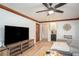 Bright living room with an entertainment center and a serving area for added convenience at 393 Westminister Sw Ln, Lilburn, GA 30047