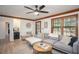 Inviting living room with wood trim and large windows that flood the space with natural light at 393 Westminister Sw Ln, Lilburn, GA 30047