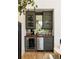 Modern bar area with wine cooler, custom cabinets, and ample storage, ideal for hosting gatherings at 77 Delmont Ne Dr, Atlanta, GA 30305