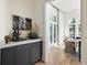 Chic bar area with marble countertop and stylish cabinets, perfect for entertaining guests in style at 77 Delmont Ne Dr, Atlanta, GA 30305