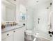 Elegant bathroom with a glass-enclosed shower, marble countertops, and gold fixtures at 77 Delmont Ne Dr, Atlanta, GA 30305
