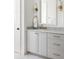 Elegant bathroom with a marble countertop vanity, stylish fixtures, and ample storage space at 77 Delmont Ne Dr, Atlanta, GA 30305
