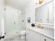 Elegant bathroom features a marble-top vanity, a glass-enclosed shower, and modern fixtures at 77 Delmont Ne Dr, Atlanta, GA 30305
