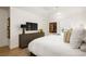 Bright and airy bedroom with modern artwork, dresser, and plush bedding for a restful atmosphere at 77 Delmont Ne Dr, Atlanta, GA 30305
