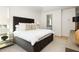 Well-lit bedroom with ample storage, stylish lamps, and a view of the adjacent bath provides a serene setting at 77 Delmont Ne Dr, Atlanta, GA 30305