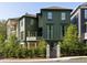Beautiful two-story home featuring an elegant wooden gate, complemented by lush landscaping for enhanced curb appeal at 77 Delmont Ne Dr, Atlanta, GA 30305