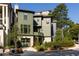 Beautiful two-story home with a three-car garage and lush landscaping showcasing curb appeal at 77 Delmont Ne Dr, Atlanta, GA 30305