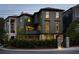 Elegant multi-story home featuring manicured landscaping, brick accents, and charming architectural details at 77 Delmont Ne Dr, Atlanta, GA 30305