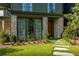 Inviting front yard with lush landscaping, stone pathway, and an attractive facade at 77 Delmont Ne Dr, Atlanta, GA 30305