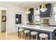 View of the kitchen island, pendant lights, and stainless steel oven at 77 Delmont Ne Dr, Atlanta, GA 30305
