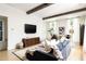 Cozy living room with a large sofa, decorative rug, and modern entertainment setup at 77 Delmont Ne Dr, Atlanta, GA 30305
