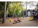 Community playground with various play structures and natural surroundings, great for Gathering fun at 77 Delmont Ne Dr, Atlanta, GA 30305