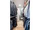 Well-organized walk-in closet with custom shelving and hardwood floors providing ample storage space at 77 Delmont Ne Dr, Atlanta, GA 30305