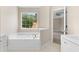 Bright bathroom features a soaking tub and ample counter space at 1125 Reunion Pl, Atlanta, GA 30331