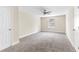 This bedroom boasts neutral walls, a ceiling fan, and plush carpeting for a serene and comfortable space at 1125 Reunion Pl, Atlanta, GA 30331