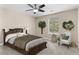 Bedroom with comfortable bed, nice decor, and natural light at 1125 Reunion Pl, Atlanta, GA 30331