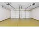 Spacious two-car garage featuring an epoxy floor and automatic door openers for convenience and durability at 1125 Reunion Pl, Atlanta, GA 30331