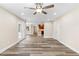 Bright, open living room features hardwood flooring and ceiling fan at 1125 Reunion Pl, Atlanta, GA 30331